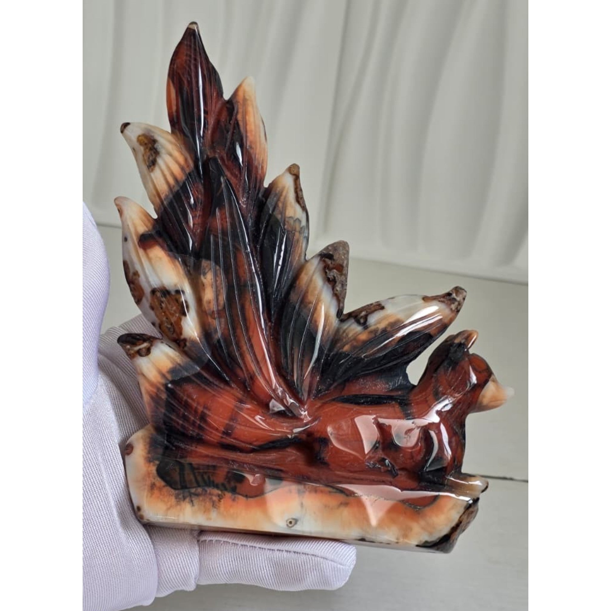 Banded Agate Nine Tails Fox XL held in hand showing size reference