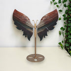 Red and black agate butterfly on a gold toned display stand