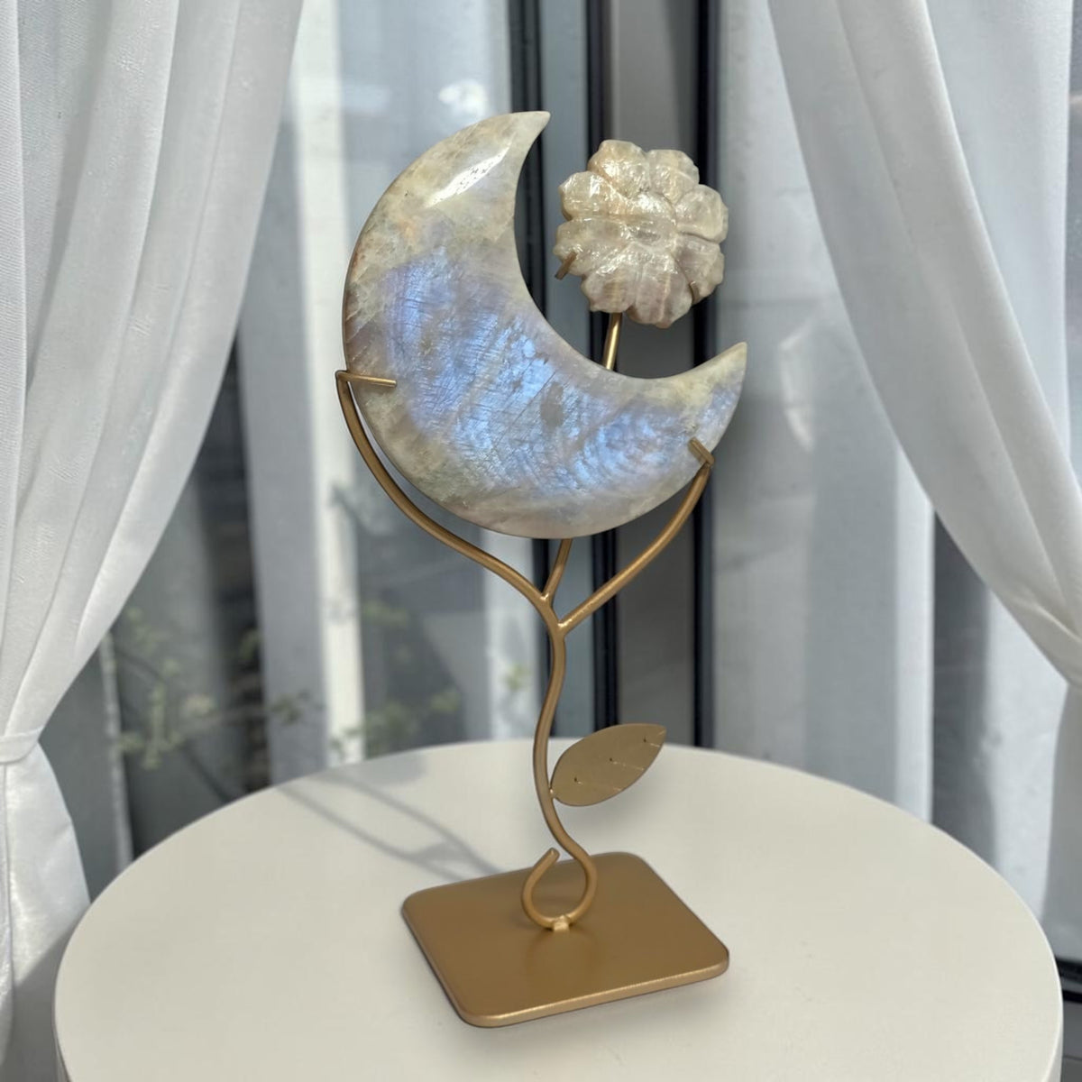 Blue flash moonstone crescent moon with carved flower on gold tone stand