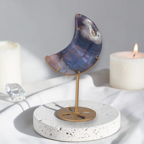 Moon-shaped blue agate on gold-tone stand with circular base