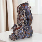 Hand-carved nine-tailed fox sculpture with dark blue, amber, and white mottled stone
