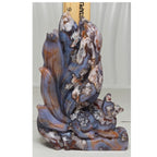 Blue-toned nine-tailed fox crystal sculpture with multicolor stone veining and paw details