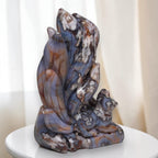 Nine-tailed fox crystal sculpture featuring tall tails, blue base, and white mineral clusters
