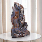 Nine-tailed fox crystal sculpture on a round base, blue stone with cream and brown bands
