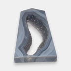 Geode-like decorative item with gray and white coloration on a white background