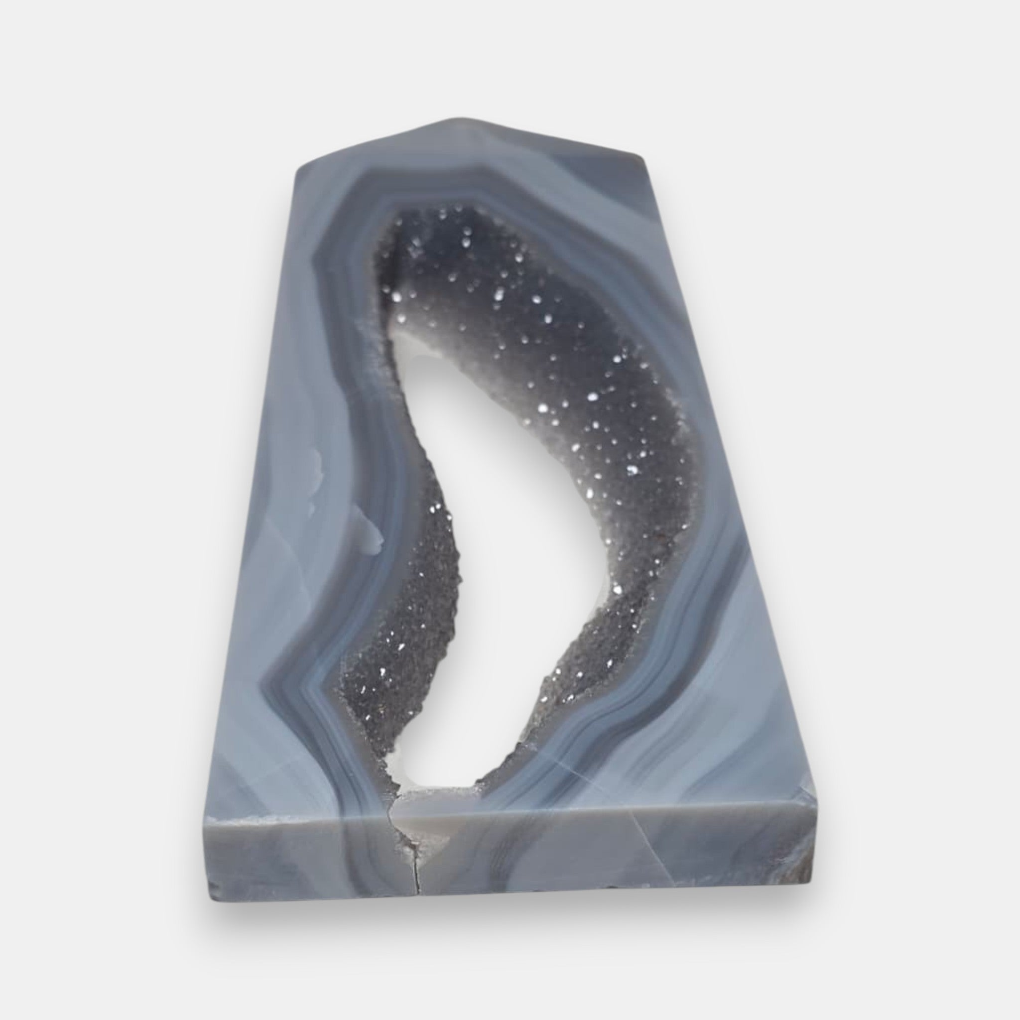 Geode-like decorative item with gray and white coloration on a white background