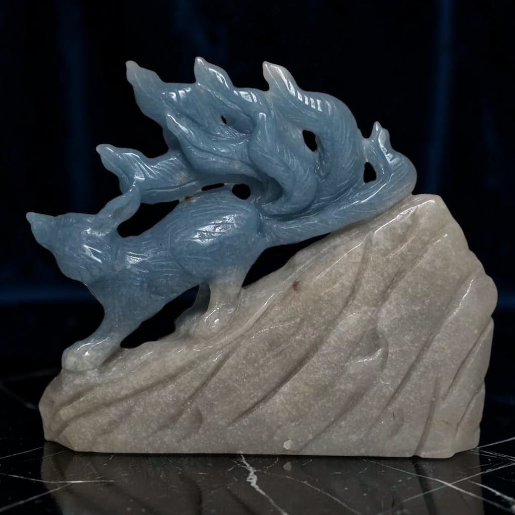 Blue trolleite nine tailed fox crystal carving back view black background