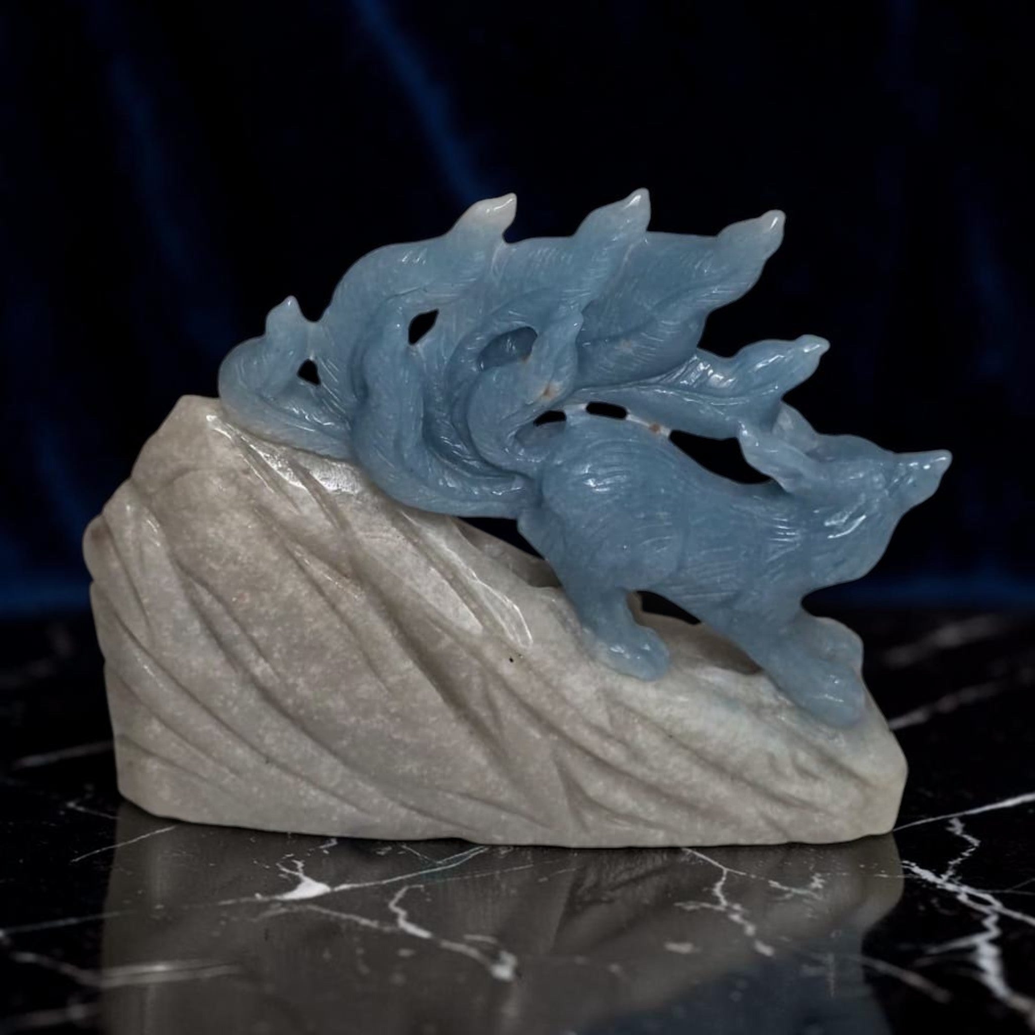 Blue trolleite nine tailed fox crystal carving front view black background