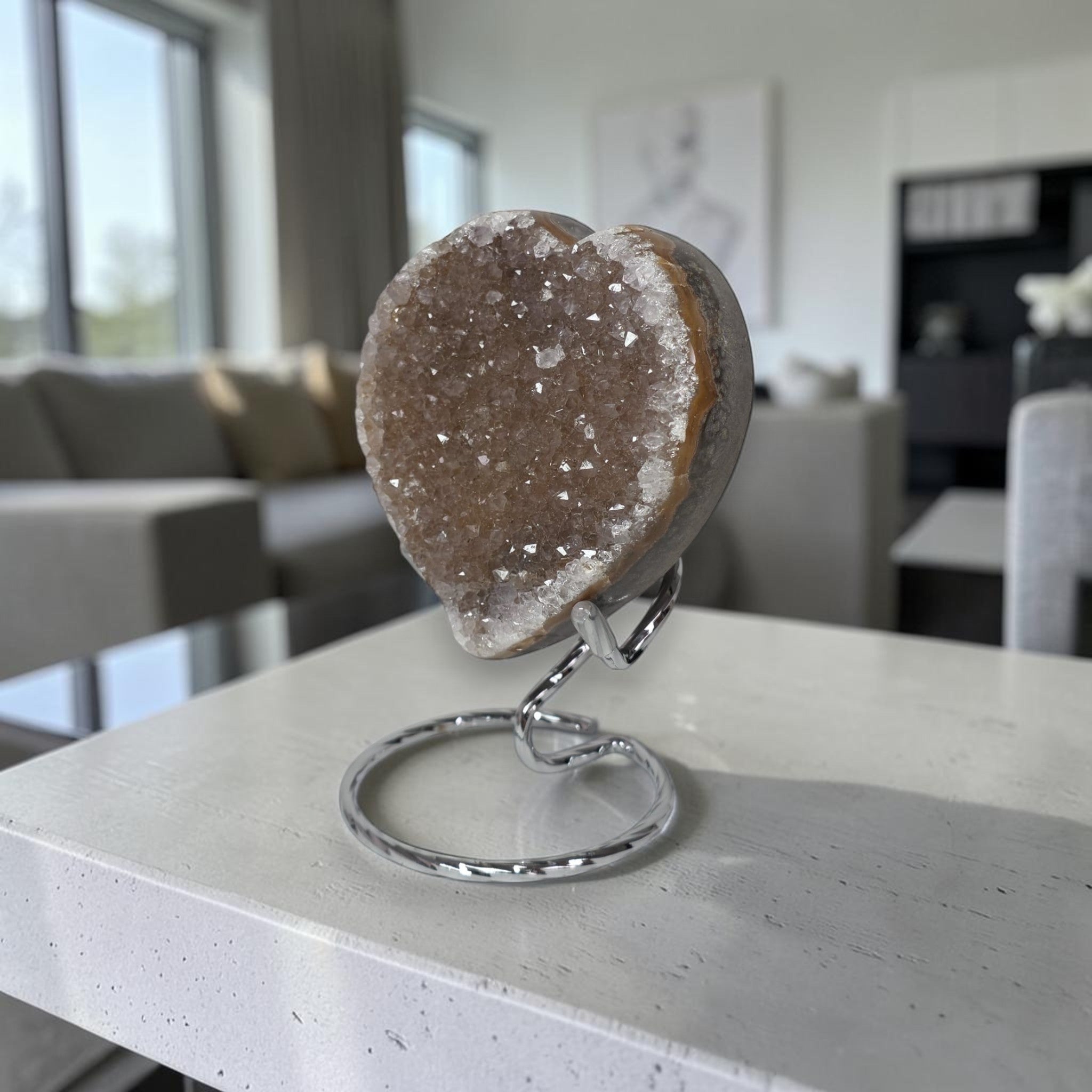 Geode crystal on a stand in a modern living room setting