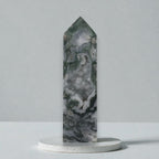 Moss agate crystal obelisk with pointed top, banded gray and dark green stone