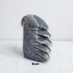 Eagle head crystal sculpture back view in glossy gray-blue stone with gemstone-like specks
