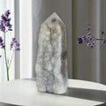 Agate drusy crystal tower with pointed top, white-gray, mossy green and brown inclusions.