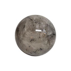 Polished tourmaline quartz sphere with dark needle-like inclusions and glossy finish