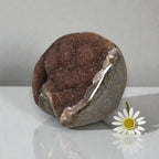 Amethyst quartz druzy freeform stone, dark purple face with pale crystal opening.