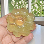 Citrine flower carving detail showing natural amber tones and petals