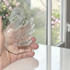 Clear Quartz swan carving detail showing feather carving and natural inclusions