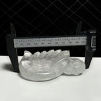 Clear Quartz swan carving hand-held showing size and clarity