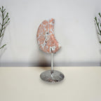 Side view of Cotton Candy Agate moon on stand