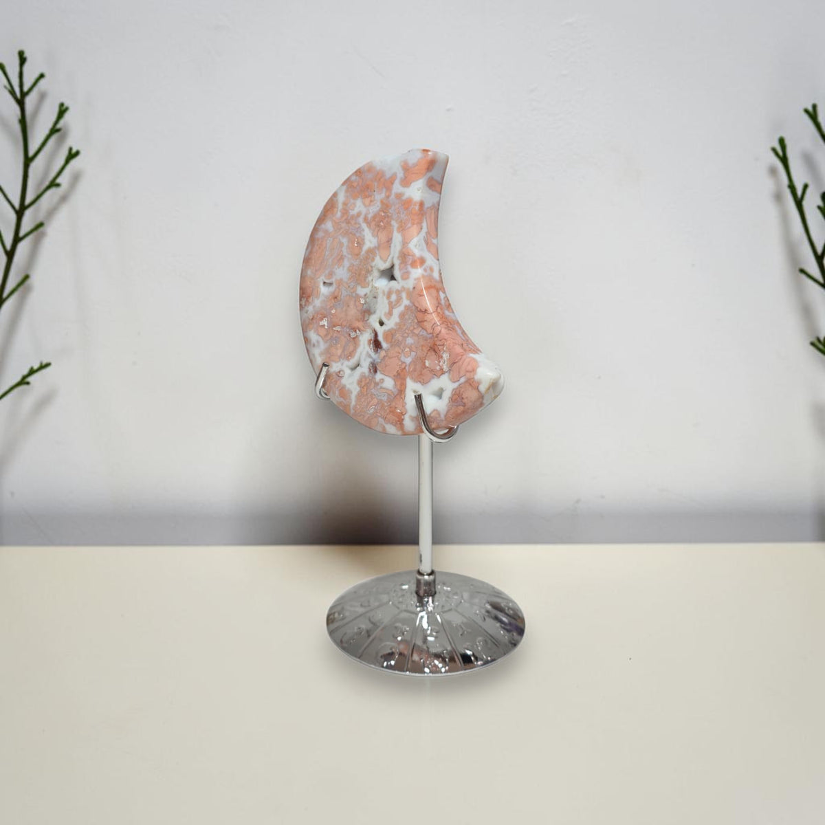 Side view of Cotton Candy Agate moon on stand