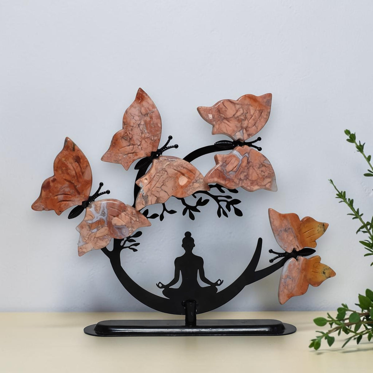 Cotton Candy Butterfly Tree with four pink and peach butterflies and a black meditation figure