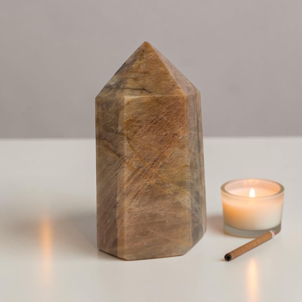 Obelisk point tower stone, polished brown-gold with pointed top and facets