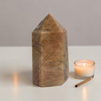 Obelisk point tower stone, polished brown-gold with pointed top and facets