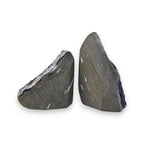Two amethyst quartz crystal pieces with dark backs and faint pale lines, shown side-by-side