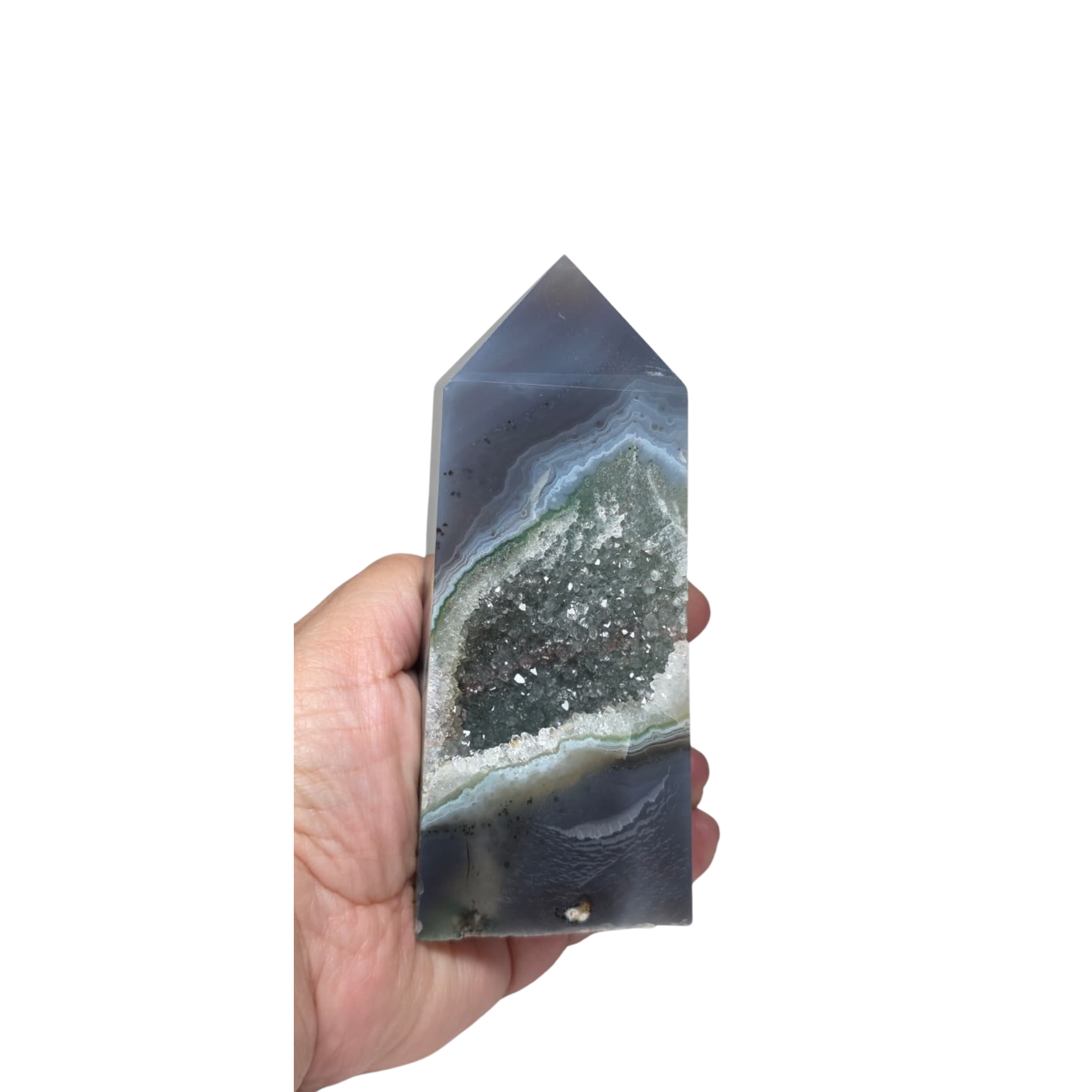 Hand holding a geometric crystal with a white background