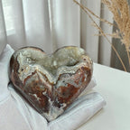 Closeup of deep druzy crystals and lace patterns in an agate heart