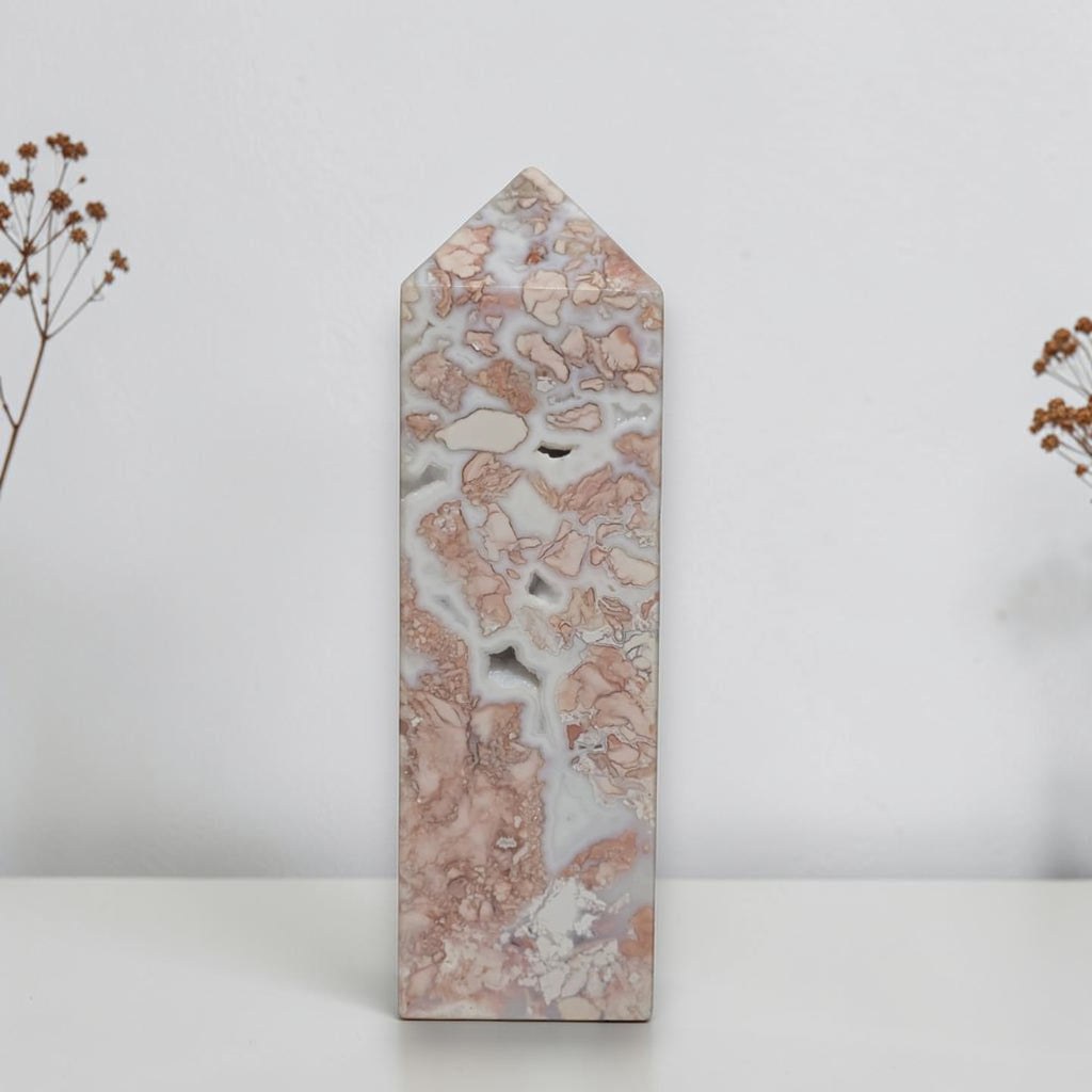 Front view of Pink Flower Agate Tower showing petal patterns and small surface openings