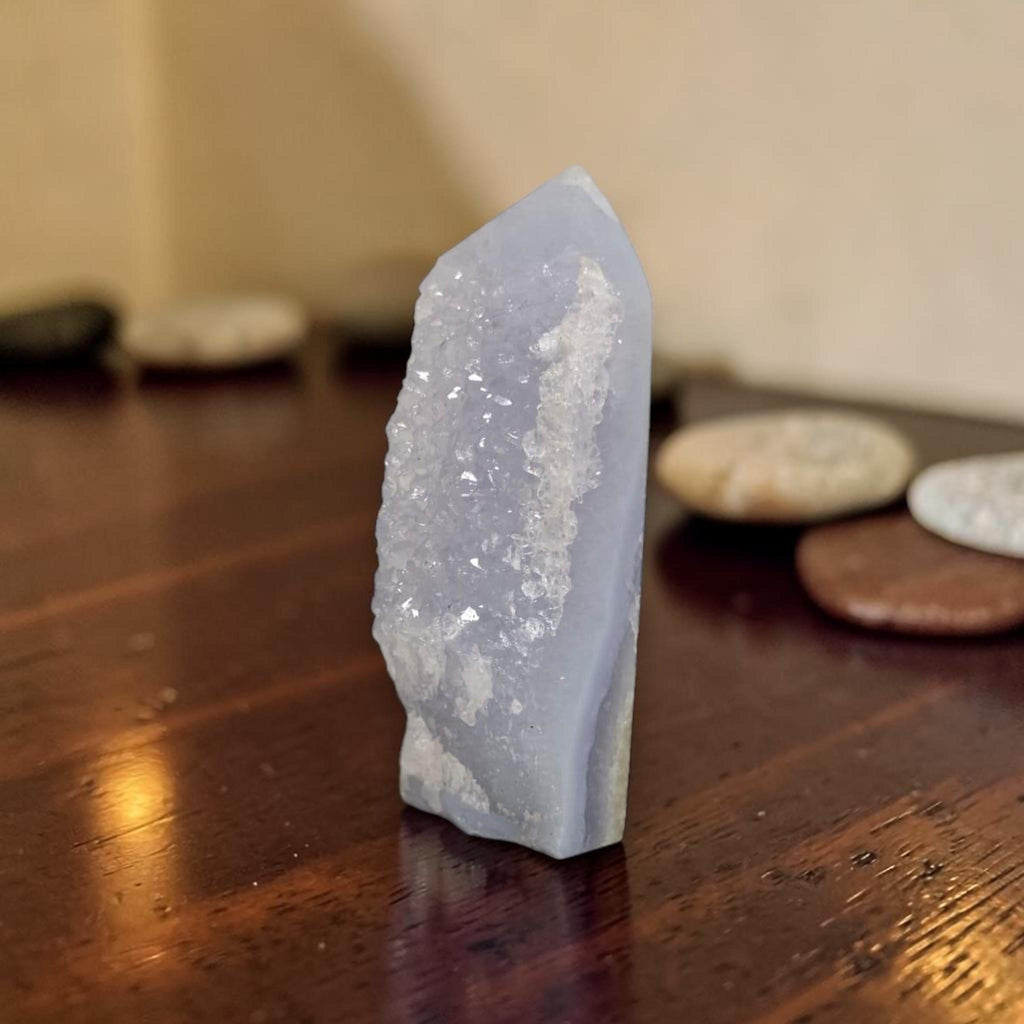 Light blue druzy crystal obelisk with pointed top and uneven faceted edges
