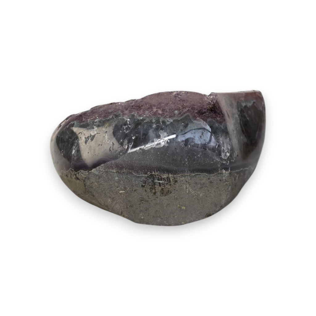 Purple druzy geode, freeform cut with clear quartz-like crack and dark outer matrix