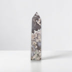 Flower agate crystal tower, dark gray with scattered white mineral clusters