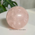 Polished rose quartz sphere, natural pale pink with clear crystalline inclusions