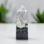 Polished moss agate tower, white-gray banding with dark base and natural green inclusions