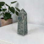 Green moss agate obelisk crystal tower with pointed top and banded stone marks