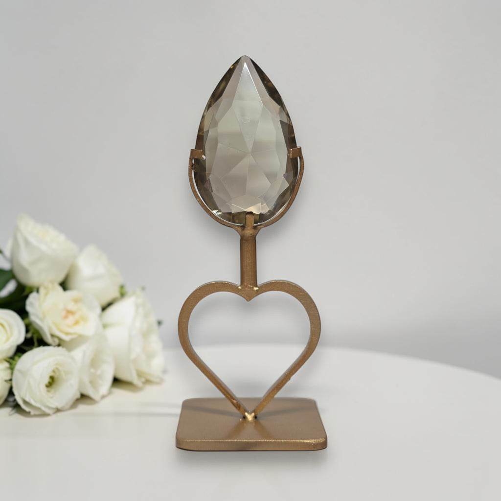 Faceted smoky quartz teardrop crystal mounted on heart stand