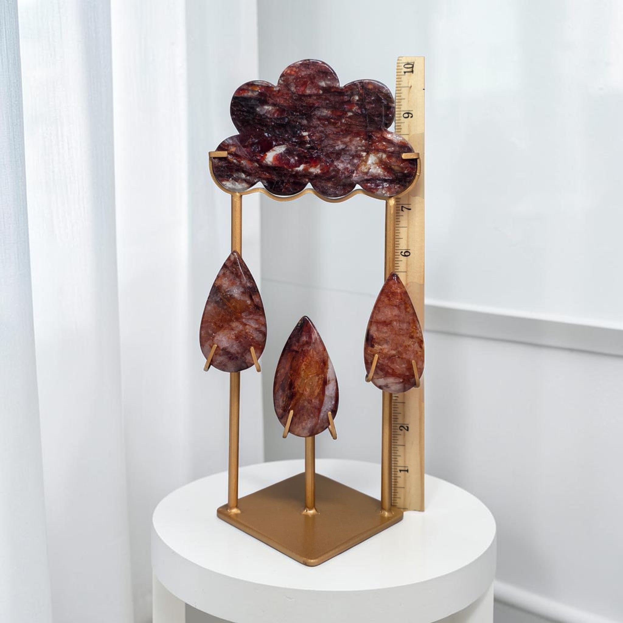 Fire quartz storm cloud display with ruler showing 10 inch height