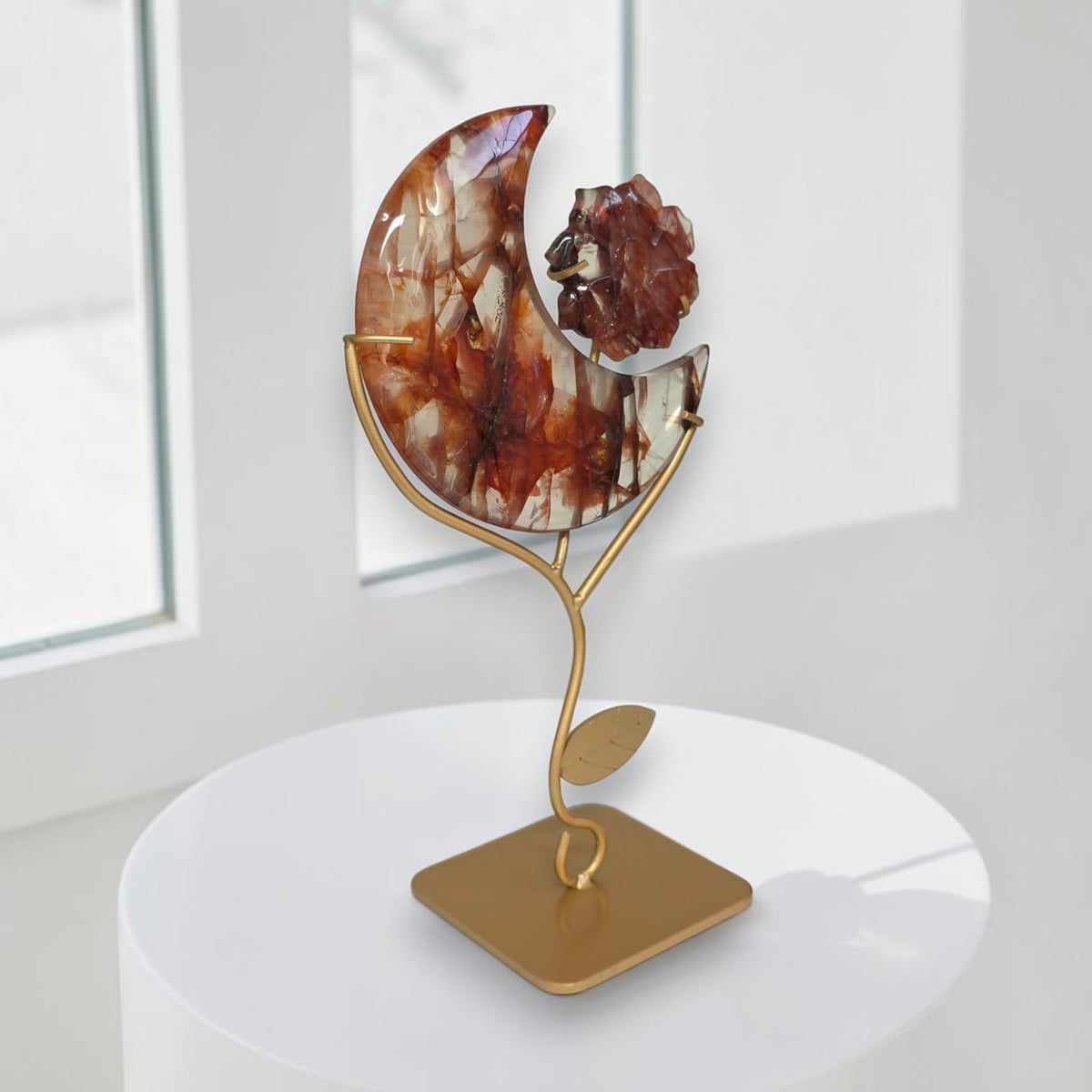 Side view of fire quartz crescent moon with flower
