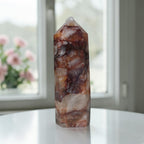 Fire Quartz tower with red brown and white quartz inclusions