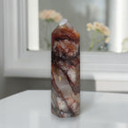 Fire Quartz tower polished six-sided point close-up