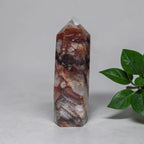 Fire Quartz tower collector piece on white surface