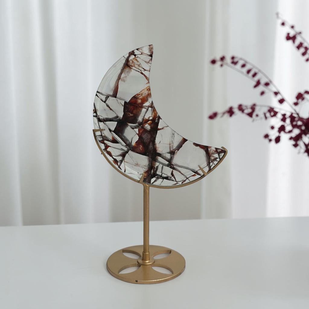 Close detail of reddish brown and dark patterns in the fire quartz crescent moon