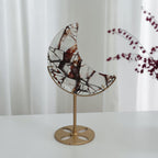 Close detail of reddish brown and dark patterns in the fire quartz crescent moon