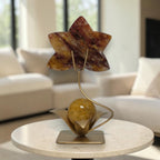 Fire Quartz orchid sculpture on gold stand side view