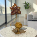 Fire Quartz orchid carving on gold stand sculpture side view