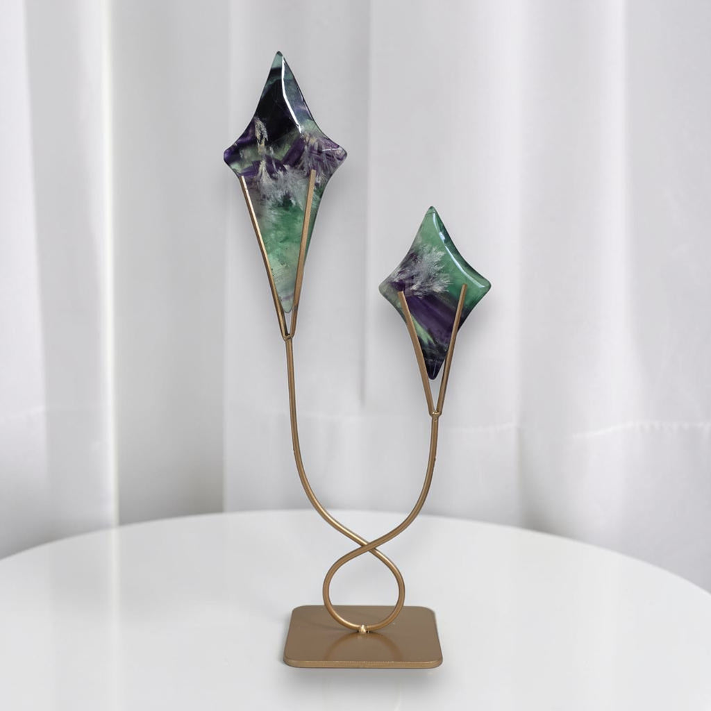 Fluorite star sculptures on gold stand with two angled star shapes