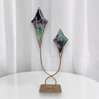 Fluorite star sculptures on gold stand with two angled star shapes