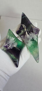 Two fluorite star pieces with green and purple marbling