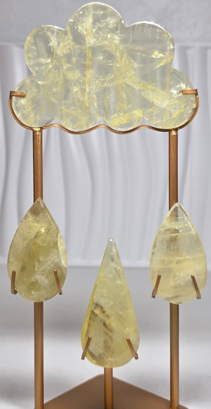 Crystal cloud sculpture with five yellow translucent teardrop crystals and gold frame